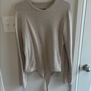 Beige Long Sleeve body suit.